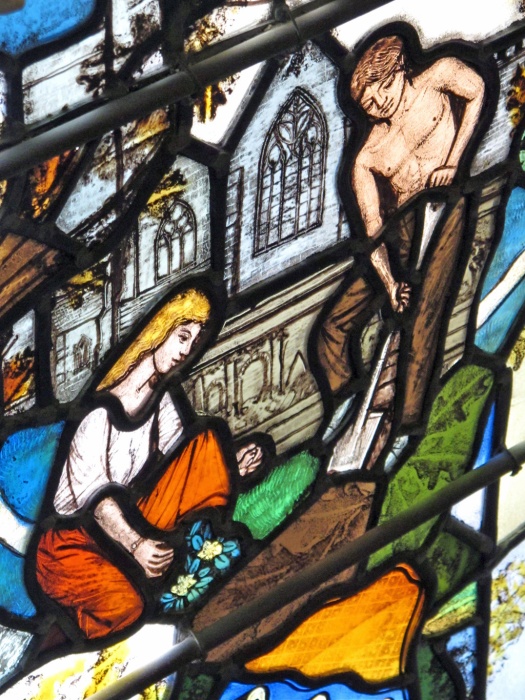 Stained glass showing Adam and Eve