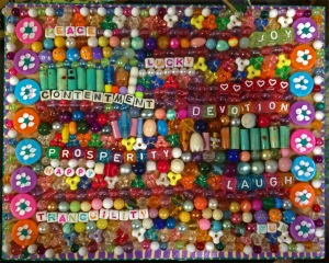 Peace, contentment, prosperity, tranquility written in beads