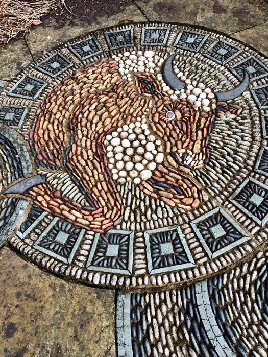 Decorative pebble floor medallion of a bull