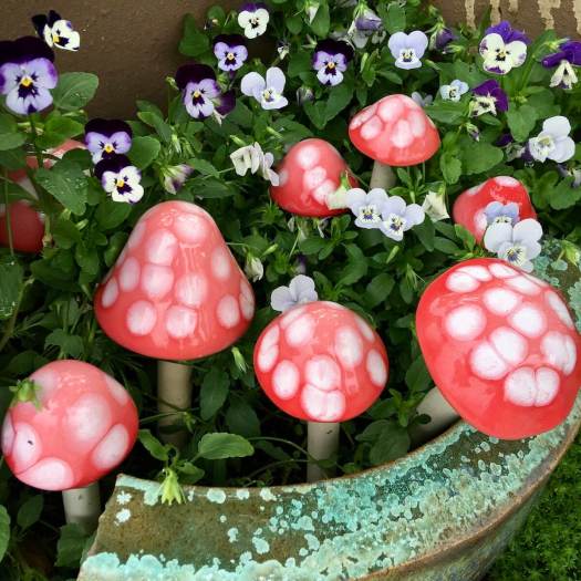 Glass toadstools and pansies